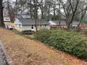 View of a backyard with mature trees and foliage creating a private retreat at 1088 Palafox Ne Dr, Atlanta, GA 30324