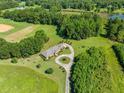 Expansive aerial view showcasing the home's large lot, circular driveway, and surrounding greenery at 226 Euharlee Five Forks Rd, Kingston, GA 30145