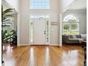 Inviting two-story foyer boasts hardwood floors and lots of natural light; access to living room and dining room at 325 Stonecastle Sw Pass, Atlanta, GA 30331