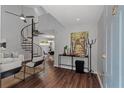 Stylish foyer with a distinctive spiral staircase, sleek console table, and contemporary artwork at 836 Saint Charles Ne Ave # I, Atlanta, GA 30306