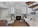 Bright living room features a cozy fireplace, built-in shelves, and elegant décor with comfortable seating at 836 Saint Charles Ne Ave # I, Atlanta, GA 30306