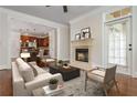 Inviting living room with a cozy fireplace, neutral tones, and plenty of natural light at 825 Highland Ne Ln # 1116, Atlanta, GA 30306