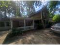 Charming two-story home with wood siding and a white picket fence at 1383 Natchez Sw Trce, Marietta, GA 30008
