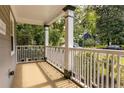 Inviting front porch with white railings, offering a relaxing outdoor space at 217 Rockyford Ne Rd, Atlanta, GA 30317