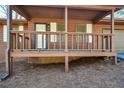 Inviting front porch with wood railing and trim at 4800 Timber Ridge Dr, Douglasville, GA 30135