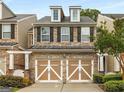 Charming townhome with stone accents, dormer windows, and a convenient two-car garage at 6038 Mayfield Se Way, Mableton, GA 30126