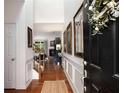 Inviting foyer with hardwood floors, wainscoting, and a view into the living space at 6038 Mayfield Se Way, Mableton, GA 30126