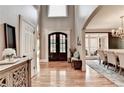 Welcoming foyer with hardwood floors, high ceilings, and views into the formal dining room at 10020 Normandy Ln, Suwanee, GA 30024