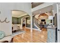 Open floor plan showcases hardwood floors, staircase and seamlessly connects living spaces at 10020 Normandy Ln, Suwanee, GA 30024