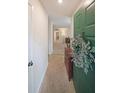 Inviting entryway featuring a decorative green door and a glimpse into the living space at 3907 Cedar Cir, Tucker, GA 30084