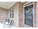 Front porch features chairs and decorative wreath at 6179 Ashbranch Dr, Acworth, GA 30101