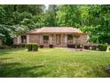 Lovely brick home with attractive landscaping, a vibrant green lawn and a welcoming curb appeal at 655 Stone Harbor Sw Pkwy, Marietta, GA 30060