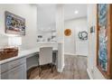 Cozy office nook with modern gray cabinets and a view into the well-lit kitchen at 916 Gambino Trce, Peachtree City, GA 30269