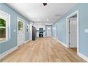 Open-concept living room and kitchen with lots of natural light and modern appliances at 5233 Groovers Landing Se Rd, Acworth, GA 30101