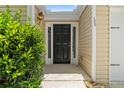 Welcoming front entrance featuring a black door, sidelights, and house number display at 110 Holly Mill Village Dr, Canton, GA 30114