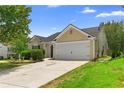 Inviting home exterior with a two-car garage, tidy landscaping, and a paved driveway at 110 Holly Mill Village Dr, Canton, GA 30114