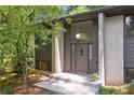 Front entrance of a well-maintained home, highlighting the modern door, stone steps and contemporary design at 3282 Leslie Court Northeast Ne Ct, Atlanta, GA 30345