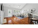 Cozy living room with hardwood floors, fireplace, and natural light at 200 Ennisbrook Se Dr, Smyrna, GA 30082