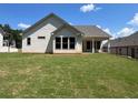 Large, level backyard, perfect for outdoor activities with a view of the home's back exterior at 341 Brooke View Trail, Canton, GA 30115