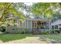 Charming single Gathering home with lovely landscaping and a cozy covered front porch at 958 Forrest Blvd, Decatur, GA 30030