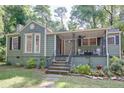 Charming single Gathering home with lovely landscaping and a cozy covered front porch at 958 Forrest Blvd, Decatur, GA 30030