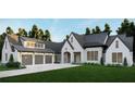 Elegant exterior with a three car garage and impeccable landscaping with new construction at 4585 Ryker Rd, Cumming, GA 30041