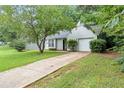 View of a single-Gathering home, featuring an attached garage and driveway at 5426 Martins Crossing Rd, Stone Mountain, GA 30088