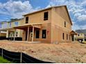 New home under construction with visible framing, siding and windows, on a neatly graded lot at 120 Winsome Way, Woodstock, GA 30188