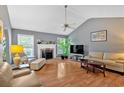 Cozy living room with hardwood floors, fireplace, vaulted ceiling, and comfortable seating at 1331 Red Hill Rd, Marietta, GA 30008