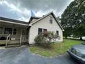 Well-maintained home with updated siding, a garden, and a convenient back porch area at 3398 Highway 81, Oxford, GA 30054