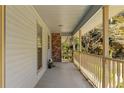 Charming covered porch, ideal for relaxing and enjoying the outdoors at 9491 Hidden Branch Dr, Jonesboro, GA 30236