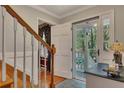 Warm foyer featuring hardwood floors and a view of the outdoor greenery at 6380 Concord Rd, Cumming, GA 30028