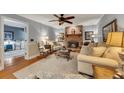 Cozy living room with a brick fireplace and comfortable seating arrangement at 6380 Concord Rd, Cumming, GA 30028