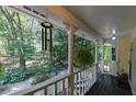 Inviting front porch with lush greenery and space for relaxation at 6380 Concord Rd, Cumming, GA 30028