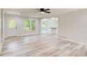 Bright, open-concept living room featuring hardwood floors and modern design at 104 Southfork Dr, Woodstock, GA 30189