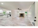 Spacious living room featuring hardwood floors and a stone fireplace at 104 Southfork Dr, Woodstock, GA 30189