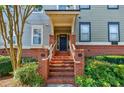 Close up of townhouse entrance with brick stairs and decorative details at 655 Mead Se St # 3, Atlanta, GA 30312