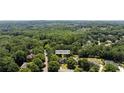 Aerial view showcasing the property at 161 Forestview Dr surrounded by lush trees at 161 Forestview Dr, Suwanee, GA 30024