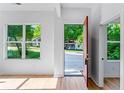 Bright entryway showcasing beautiful hardwood floors and a view of the green outdoors at 1835 Taylor Ave, East Point, GA 30344