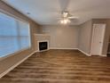 Living room featuring a fireplace, hardwood floors, and natural light at 285 Fieldview Ln, Covington, GA 30016