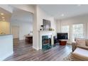 The living room offers wood floors and a marble fireplace at 3275 Lenox Ne Rd # 413, Atlanta, GA 30324