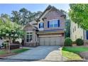 Charming brick two-story home with a well-manicured lawn and a two-car garage at 4335 Bellview Ln, Duluth, GA 30097