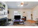 Cozy living room with a fireplace, neutral colors, and natural lighting at 80 Jacob Trl, Rockmart, GA 30153