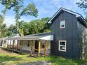 Attractive two-story house with a covered porch and gray siding at 5310 Lyndale Cir, Forest Park, GA 30297