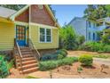 Close-up of a home entrance with landscaped garden beds and cozy lighting at 350 Lamplighter Se Ln, Marietta, GA 30067