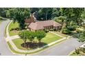 An elevated view showcasing a well-maintained lawn, mature trees, and established landscaping at 4063 Penhurst Dr, Marietta, GA 30062