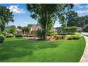 Expansive backyard with a well-manicured lawn, mature trees, and a cozy deck perfect for relaxing at 4063 Penhurst Dr, Marietta, GA 30062