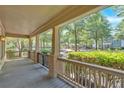 Spacious covered front porch, perfect for relaxing and enjoying the view of the neighborhood at 3278 Shakerley Park, Douglasville, GA 30135
