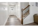 Bright foyer featuring arched doorways, durable flooring and staircase with wood and metal accents at 1982 Brightleaf Way, Marietta, GA 30060