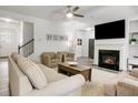 Inviting living room with a cozy fireplace, plush seating, and an open layout at 1982 Brightleaf Way, Marietta, GA 30060